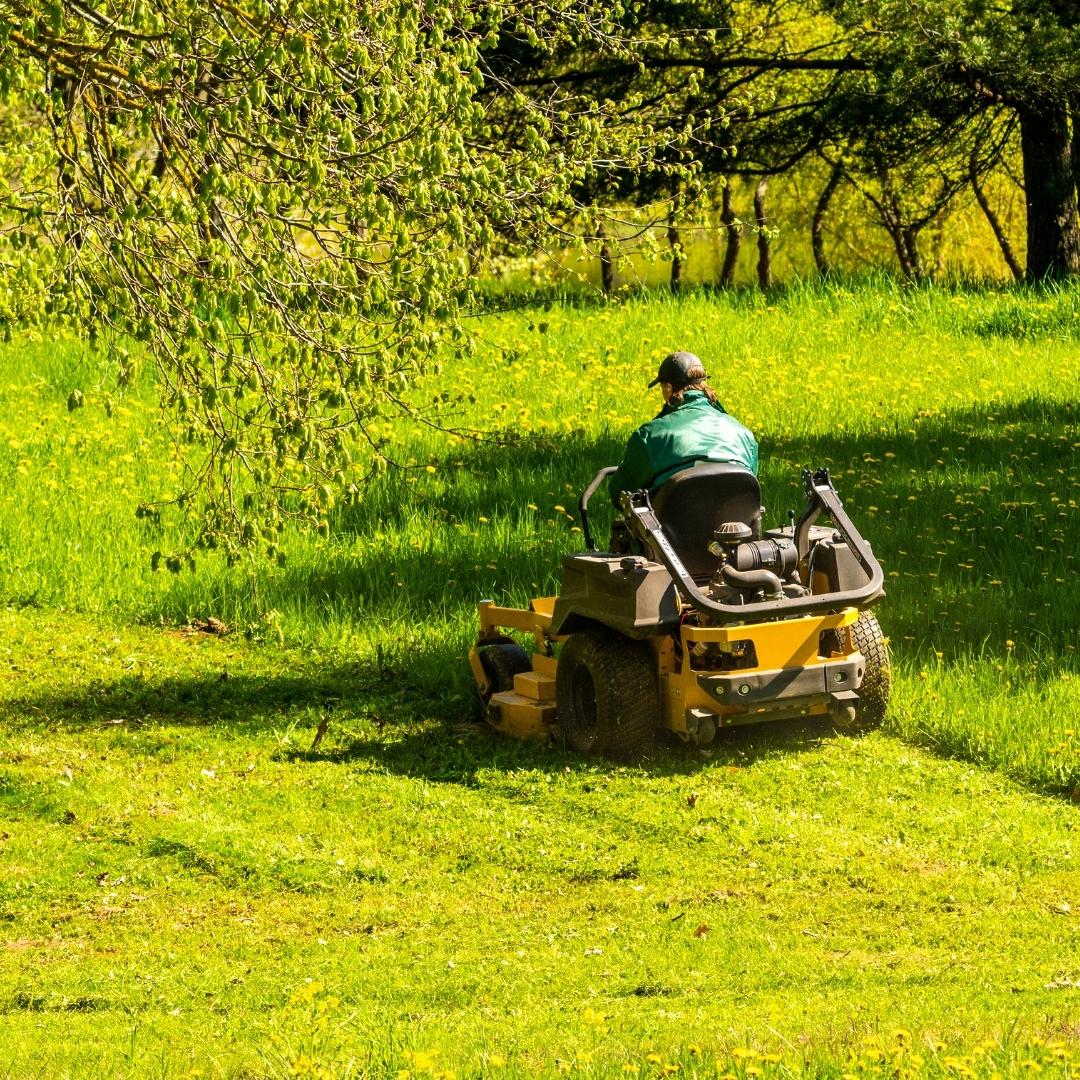 mowing grass on riding mower